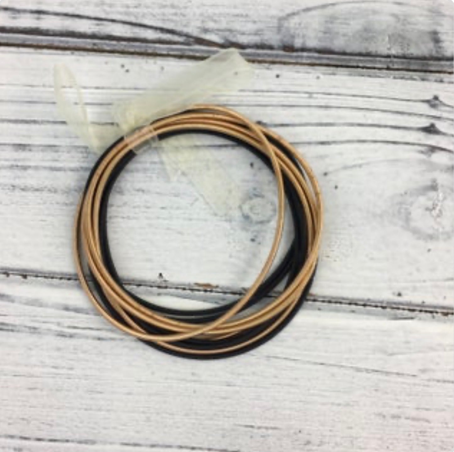 Black and gold guitar string bracelet